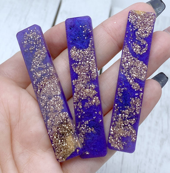 Purple and gold resin clip