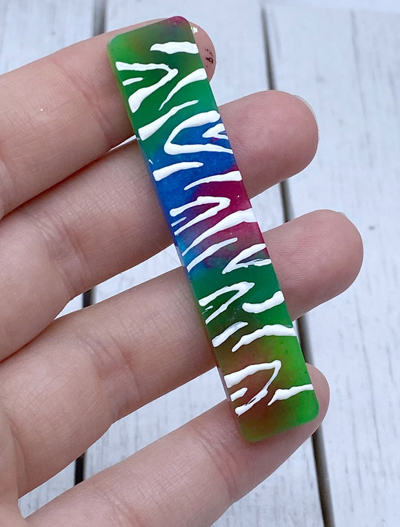 Rainbow tiger glow in the dark stripes resin clip