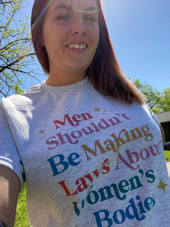 Men shouldn’t be making laws tee shirt shown on grey