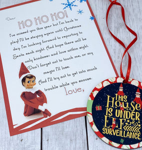 Double sided elf surveillance ornament with welcome back card